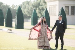 Indian couple posing outdoors for first look shoot. Indian couple posing outdoors for first look shoot.