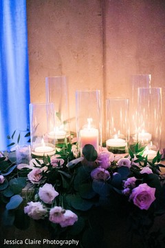 Pink roses and white candles at Indian wedding decoration. Pink roses and white candles at Indian wedding decoration.