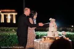 Indian bride and groom cutting cake together. Indian bride and groom cutting cake together.