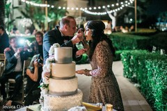 Indian newlyweds sharing their wedding cake. Indian newlyweds sharing their wedding cake.