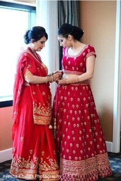 Maharani putting on her wedding ceremony lehenga. Maharani putting on her wedding ceremony lehenga.
