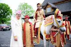 Indian relative posing with Indian groom at baraat celebration. Indian relative posing with Indian groom at baraat celebration.