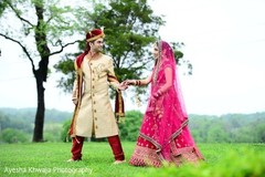 Indian couple walking on ceremony outfits. Indian couple walking on ceremony outfits.