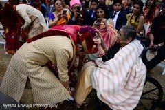 Indian groom touching relatives feet ritual. Indian groom touching relatives feet ritual.