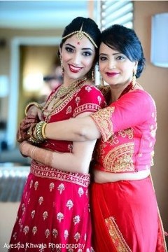 Indian bride posing with mother photography. Indian bride posing with mother photography.