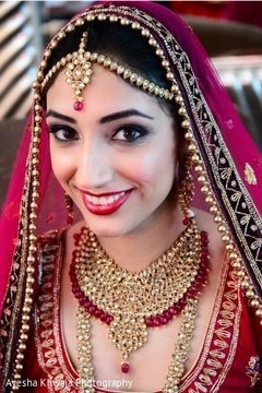 Indian bride wearing her ceremony jewelry on. Indian bride wearing her ceremony jewelry on.
