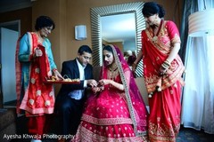 Indian bride being helped to get ready capture. Indian bride being helped to get ready capture.