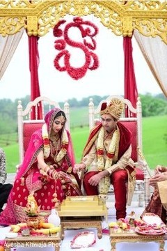 Indian bride and groom at ceremony fire ritual. Indian bride and groom at ceremony fire ritual.