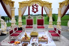 Indian wedding ceremony mandap golden, white and red decor. Indian wedding ceremony mandap golden, white and red decor.