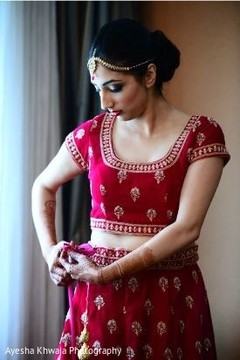 Traditional luxury red and golden bridal ceremony lehenga. Traditional luxury red and golden bridal ceremony lehenga.