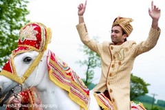 Indian groom with his golden outfit on his baraat horse. Indian groom with his golden outfit on his baraat horse.