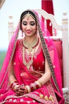 Maharani on her Indian wedding ceremony red lehenga. Maharani on her Indian wedding ceremony red lehenga.