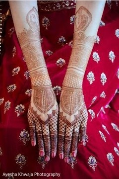 Indian bride showing her wedding mehndi art. Indian bride showing her wedding mehndi art.