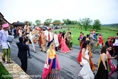 Indian wedding guest walking next to Indian groom on his baraat horse. Indian wedding guest walking next to Indian groom on his baraat horse.