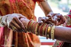 Golden and red bracelets worn by Maharani. Golden and red bracelets worn by Maharani.