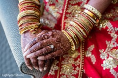 Indian bride showing her mehndi art and jewelry. Indian bride showing her mehndi art and jewelry.