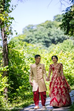Indian bride and Indian groom with Indian wedding clothes walking. Indian bride and Indian groom with Indian wedding clothes walking.