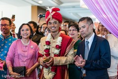 Indian groom with his Indian parents during his Indian wedding. Indian groom with his Indian parents during his Indian wedding.