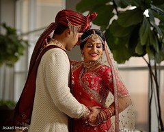 Indian couple posing on their wedding ceremony outfits. Indian couple posing on their wedding ceremony outfits.