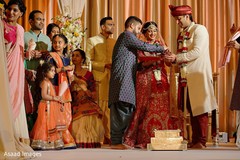 Indian couple holding rice for Indian wedding ritual. Indian couple holding rice for Indian wedding ritual.