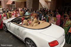 Indian couple leaving ceremony on their white vehicle. Indian couple leaving ceremony on their white vehicle.