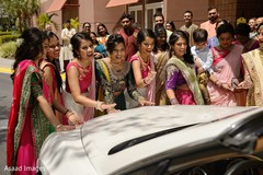 Indian bridesmaids stopping the Indians couple white vehicle game. Indian bridesmaids stopping the Indians couple white vehicle game.
