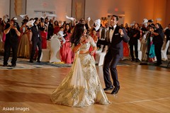 Indian couple having an up beat dance at reception party. Indian couple having an up beat dance at reception party.
