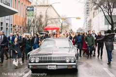 Indian groom riding his luxury car during the baraat. Indian groom riding his luxury car during the baraat.