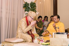 Indian groom having a spiritual moment during the celebrations. Indian groom having a spiritual moment during the celebrations.