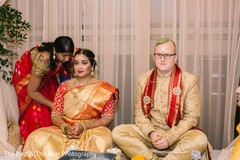 Indian couple wearing traditional attires during the ceremony. Indian couple wearing traditional attires during the ceremony.
