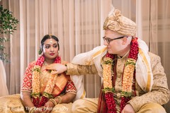 Indian bride wearing the flower garland next to the Raja. Indian bride wearing the flower garland next to the Raja.