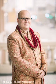 Raja posing with the beige sherwani prior to the ceremony. Raja posing with the beige sherwani prior to the ceremony.