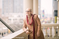 Raja posing for pictures wearing the traditional sherwani. Raja posing for pictures wearing the traditional sherwani.