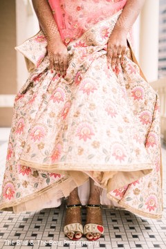 Indian bride showing her feet henna art and bridal saree. Indian bride showing her feet henna art and bridal saree.