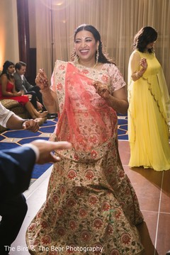 Indian bride wearing the champagne and coral saree. Indian bride wearing the champagne and coral saree.