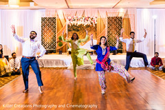 Indian groomsmen and Indian bridesmaids in dancing performance. Indian groomsmen and Indian bridesmaids in dancing performance.