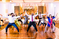 Indian groom and his Indian groomsmen performing. Indian groom and his Indian groomsmen performing.