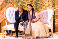 Maharani and her Indian groom laughing in the reception party. Maharani and her Indian groom laughing in the reception party.