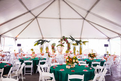 Indian wedding table setup in white tent. Indian wedding table setup in white tent.