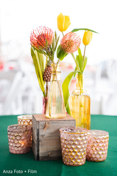 Indian wedding Yellow and orange tropical flowers table centerpiece. Indian wedding Yellow and orange tropical flowers table centerpiece.