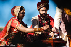 Indian couple during the traditional AgniPooja rituals. Indian couple during the traditional AgniPooja rituals.