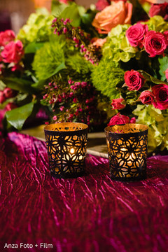 Golden Indian wedding reception table candle holders. Golden Indian wedding reception table candle holders.