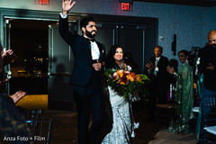 Indian lovebirds grand entrance to wedding reception Indian lovebirds grand entrance to wedding reception