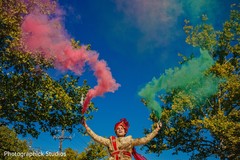 Indian groom with the color smoke during Baraat. Indian groom with the color smoke during Baraat.