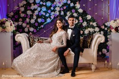 Indian bride and groom posing for the photoshoot. Indian bride and groom posing for the photoshoot.