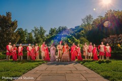 Indian bride and groom posing with groomsmen and Maharanis. Indian bride and groom posing with groomsmen and Maharanis.