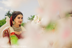 Indian bride with her golden and green kundan set on. Indian bride with her golden and green kundan set on.