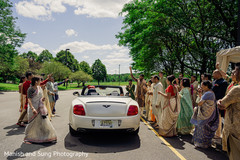 Indian couple leaving ceremony on their convertible Bentley. Indian couple leaving ceremony on their convertible Bentley.