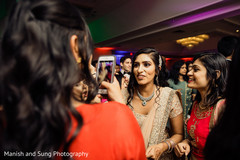 Indian bride sharing with bridesmaids at reception party. Indian bride sharing with bridesmaids at reception party.
