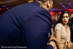 Indian bride and wedding guests dancing at reception. Indian bride and wedding guests dancing at reception.